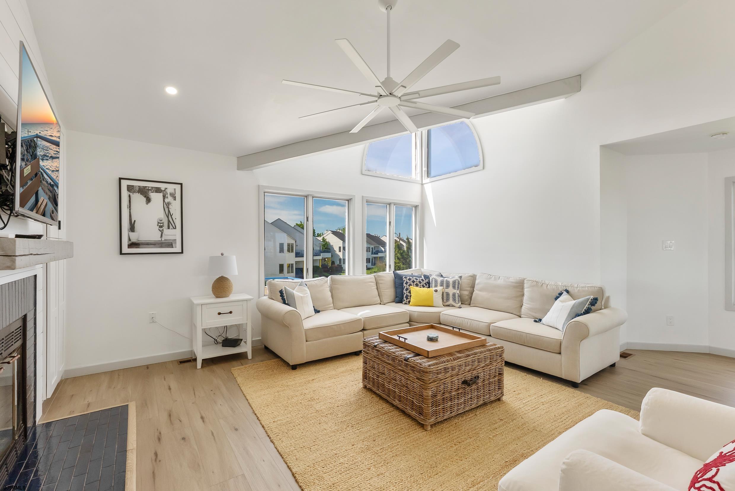 13 Delmar Drive, Unit 13 Brigantine, NJ 08203 - Photo 38 of 98 a living room with furniture and a flat screen tv