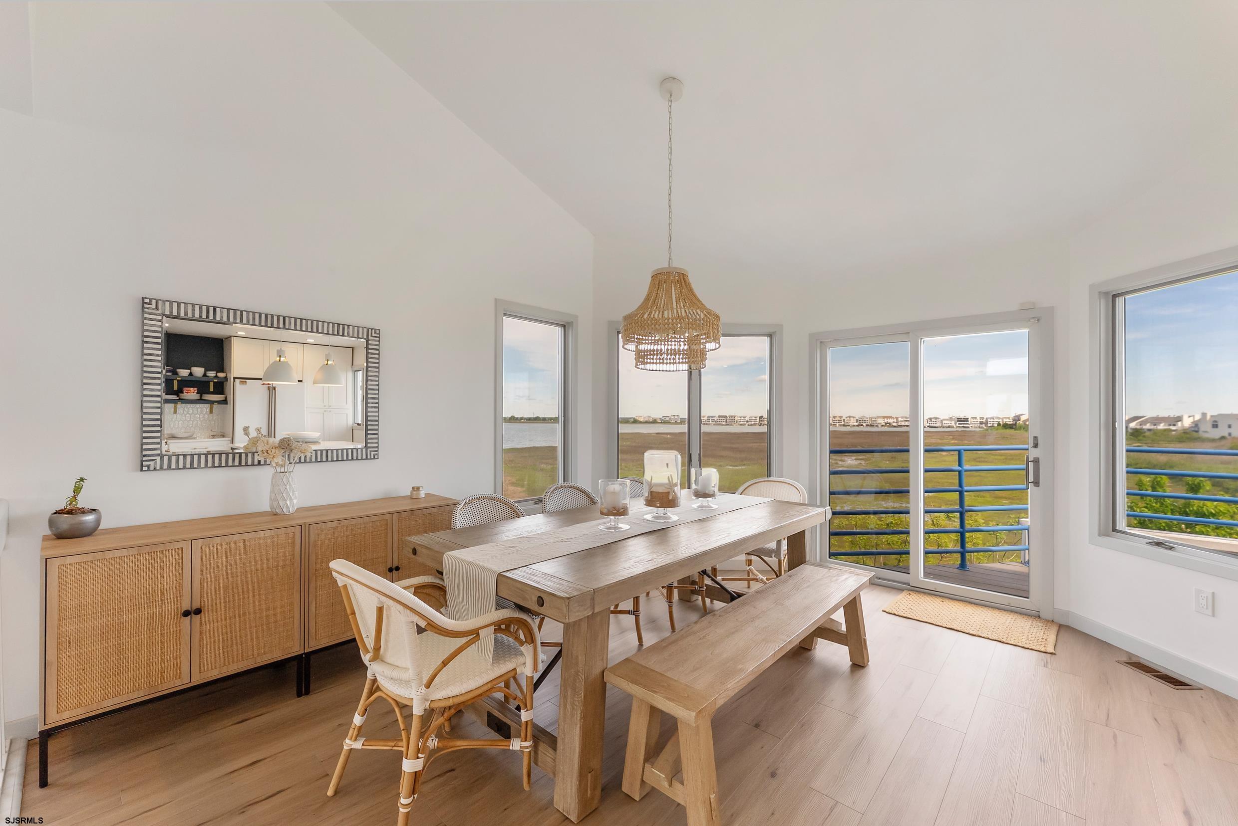 13 Delmar Drive, Unit 13 Brigantine, NJ 08203 - Photo 44 of 98 a view of a dining room with furniture window and wooden floor