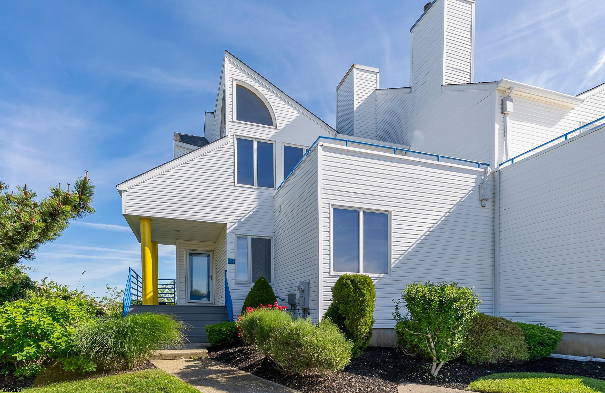 13 Delmar Drive, Unit 13 Brigantine, NJ 08203 - Photo 64 of 98 a view of a house with brick walls and potted plants
