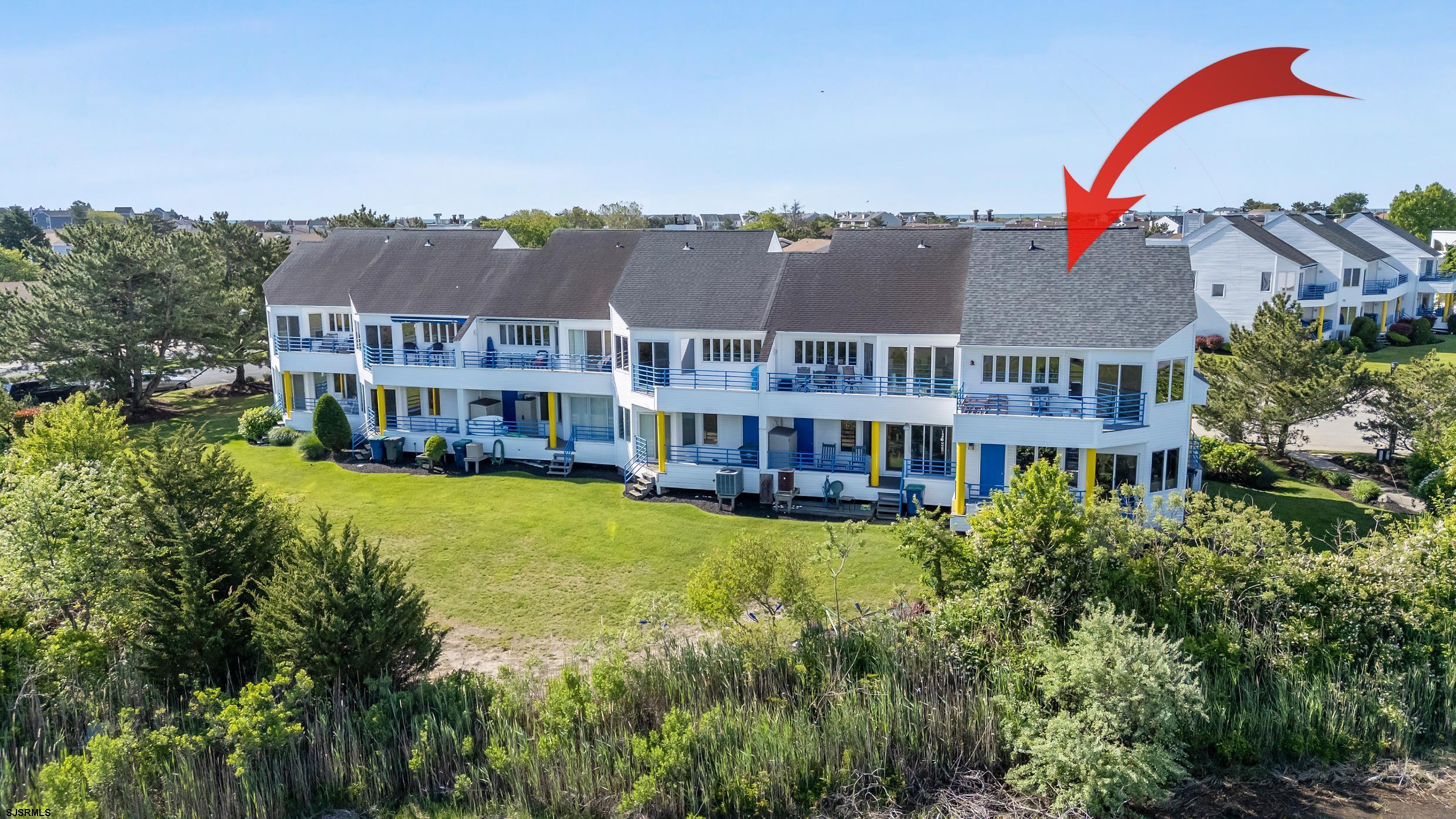 13 Delmar Drive, Unit 13 Brigantine, NJ 08203 - Photo 78 of 98 a aerial view of a house with swimming pool and a yard