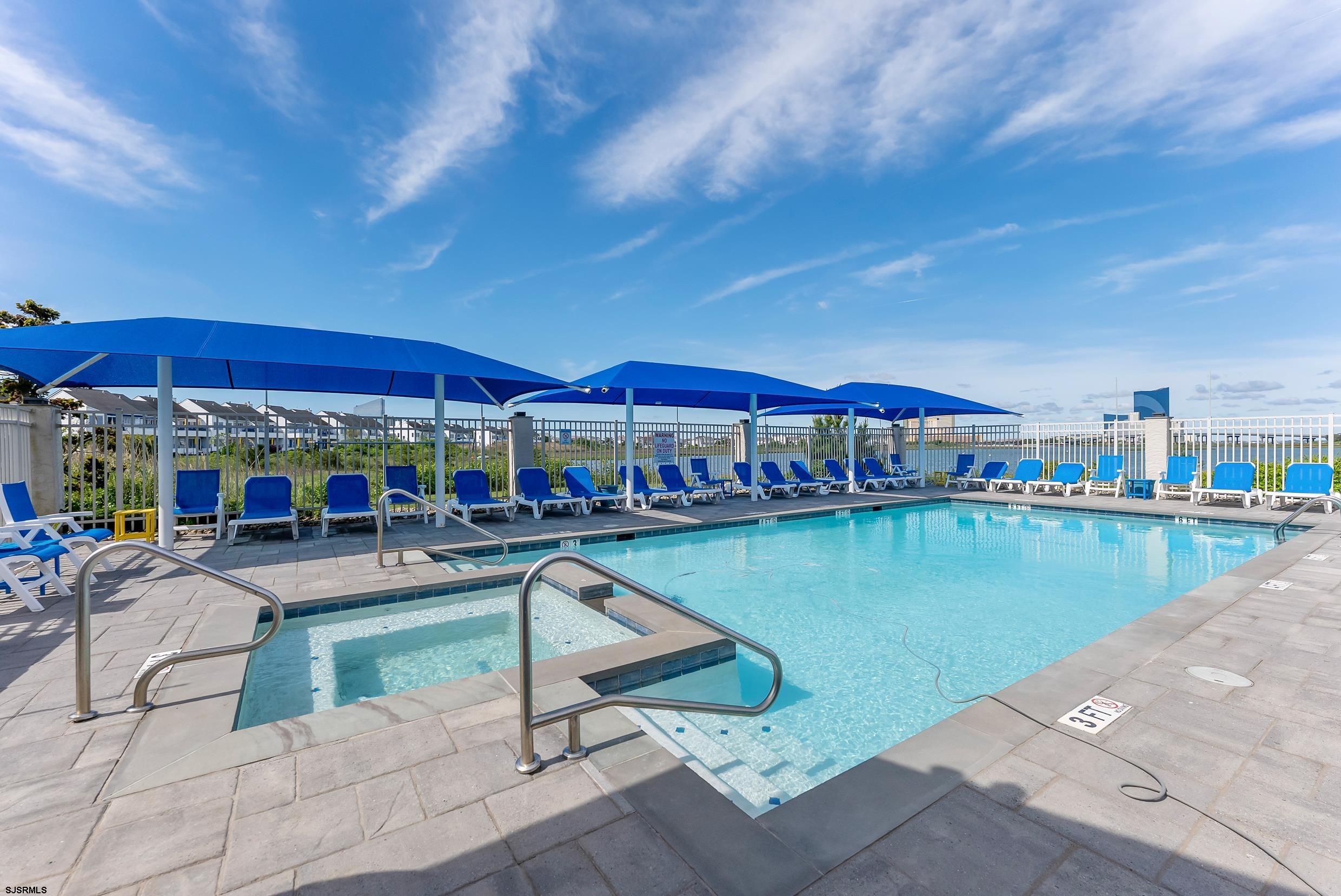 13 Delmar Drive, Unit 13 Brigantine, NJ 08203 - Photo 96 of 98 a view of a swimming pool with outdoor seating