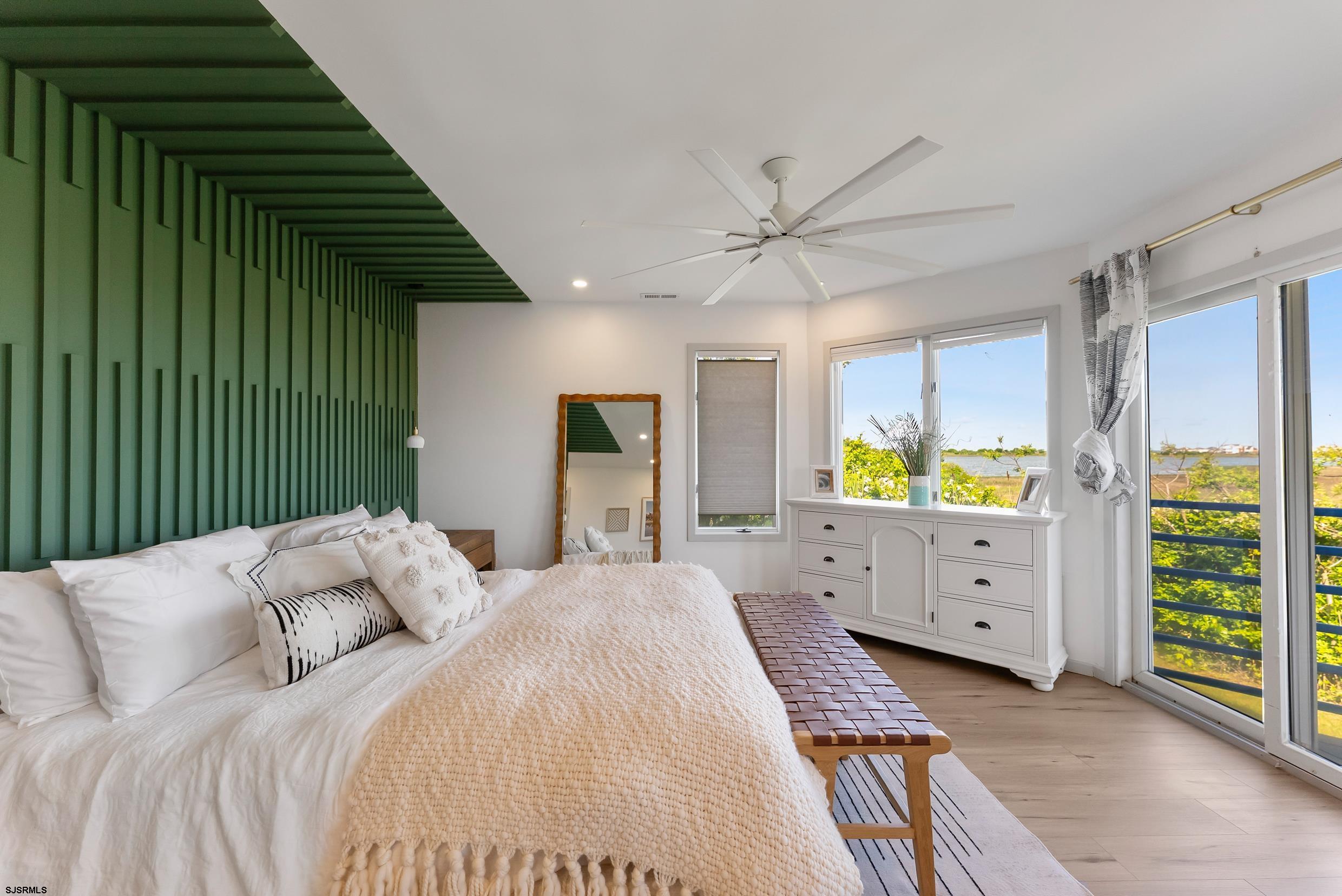 13 Delmar Drive, Unit 13 Brigantine, NJ 08203 - Photo 10 of 98 a bedroom with a bed and a window dresser