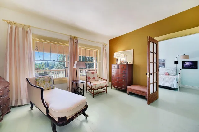 a bedroom with a bed and a couch