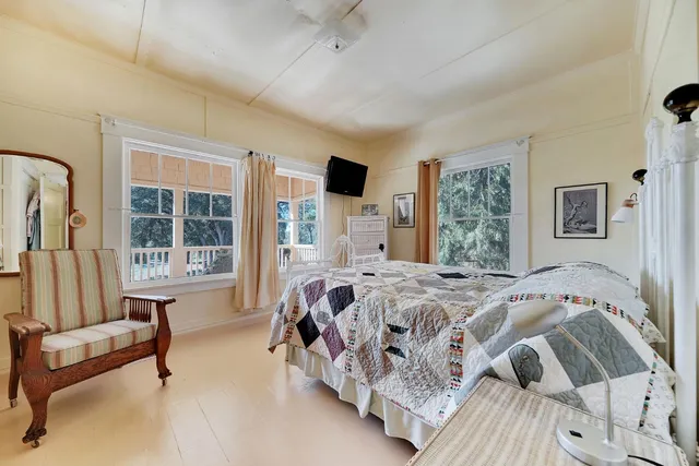 a bed room with a bed and a table