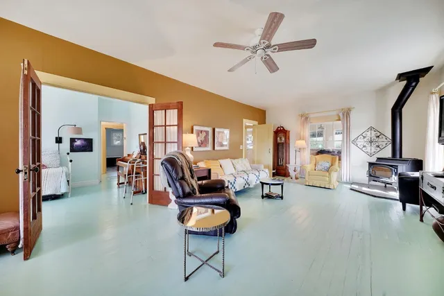 a bathroom with a sink mirror and tub