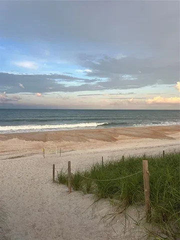 a view of a yard with an ocean view