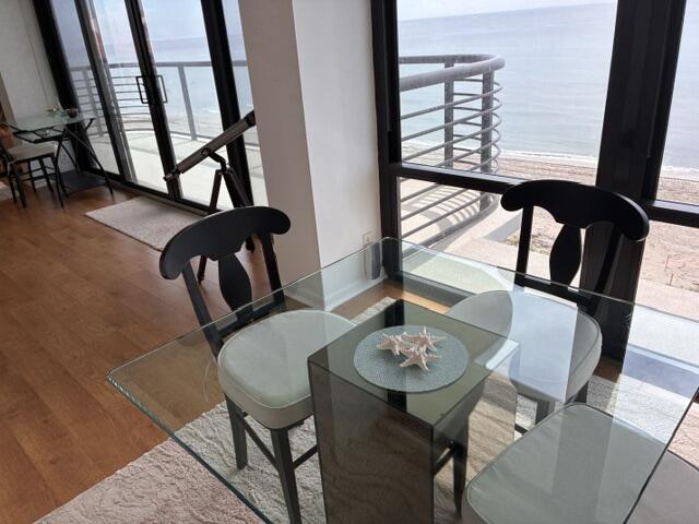 250 South Ocean Boulevard, Unit 3H Boca Raton, FL 33432 - Photo 4 of 45 a view of a dining room with furniture and wooden floor