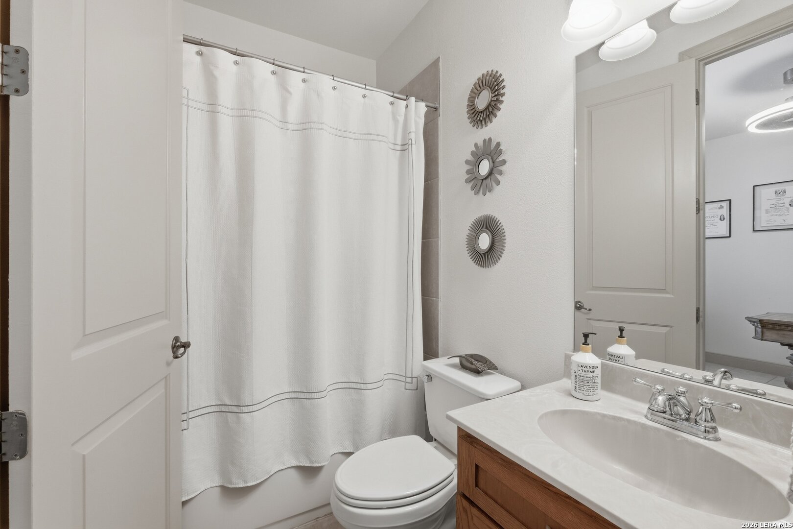 426 Legacy Ridge San Antonio, TX 78258 - Photo 29 of 38 a bathroom with a sink toilet and shower