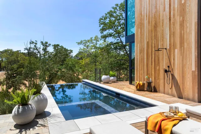 a balcony with a table and chairs