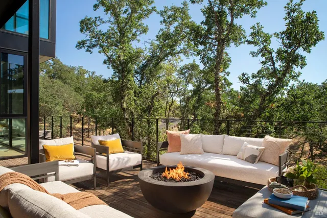 a bedroom with bed and large windows