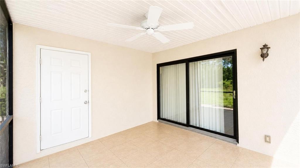 5410 16th Place Southwest, Unit B1 Naples, FL 34116 - Photo 11 of 26 an empty room with windows and closet