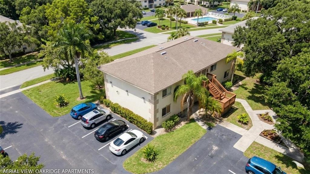 5410 16th Place Southwest, Unit B1 Naples, FL 34116 - Photo 24 of 26 an aerial view of a house with garden space and street view