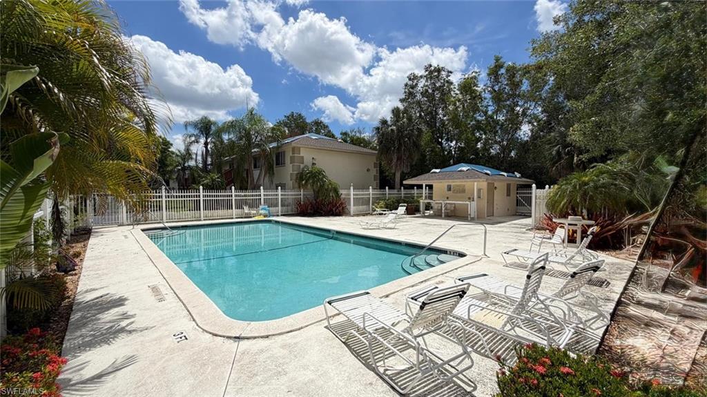5410 16th Place Southwest, Unit B1 Naples, FL 34116 - Photo 25 of 26 a view of a swimming pool with a patio