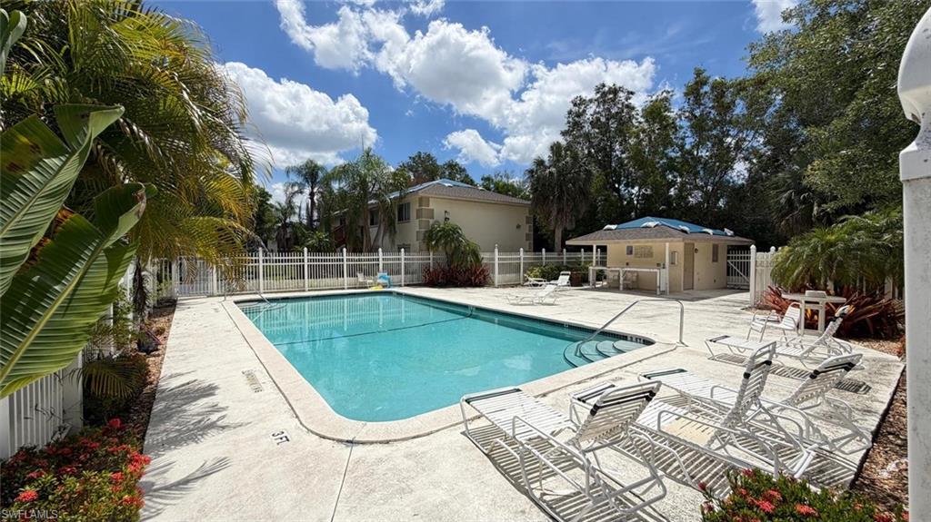 5410 16th Place Southwest, Unit B1 Naples, FL 34116 - Photo 26 of 26 a view of a swimming pool with a patio