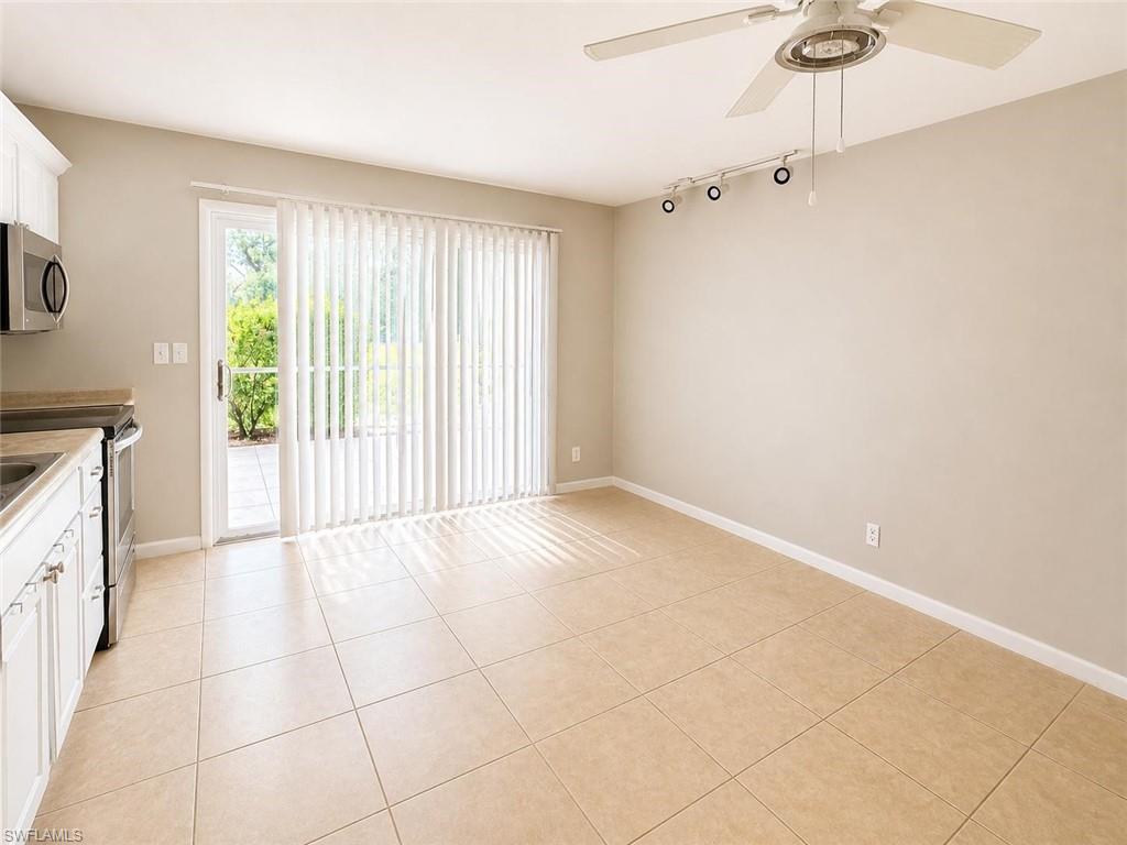 5410 16th Place Southwest, Unit B1 Naples, FL 34116 - Photo 3 of 26 a view of an empty room with a window
