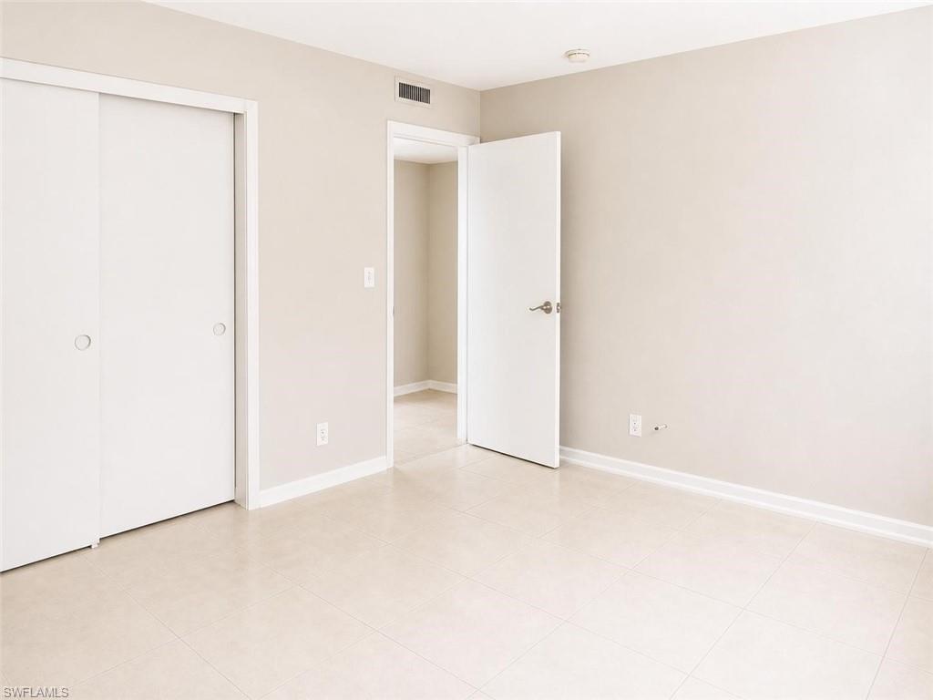 5410 16th Place Southwest, Unit B1 Naples, FL 34116 - Photo 4 of 26 a view of an empty room