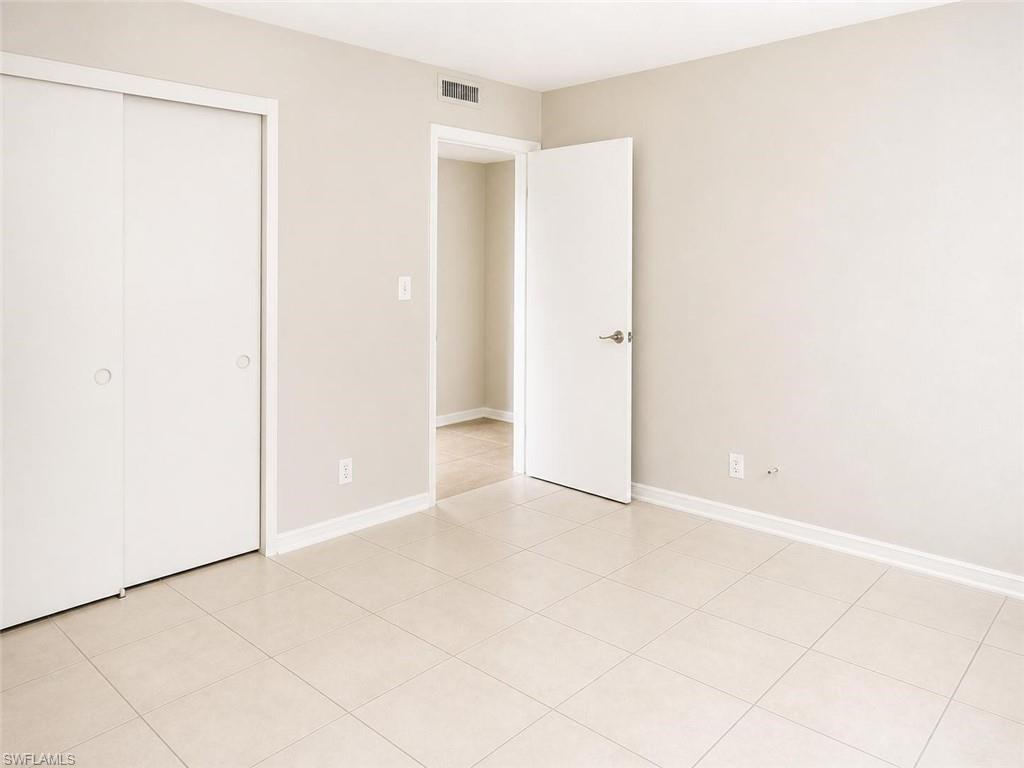 5410 16th Place Southwest, Unit B1 Naples, FL 34116 - Photo 7 of 26 a view of an empty room