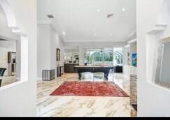 8370 Whispering Oak Way West Palm Beach, FL 33411 - Photo 3 of 14 a living room with furniture a window and a table