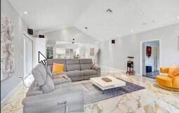 8370 Whispering Oak Way West Palm Beach, FL 33411 - Photo 4 of 14 a living room with furniture and a table