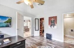 8370 Whispering Oak Way West Palm Beach, FL 33411 - Photo 6 of 14 a living room with furniture and wooden floor