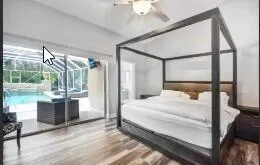 a bedroom with a bed and a mirror