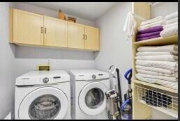 8370 Whispering Oak Way West Palm Beach, FL 33411 - Photo 10 of 14 a utility room with dryer and washer