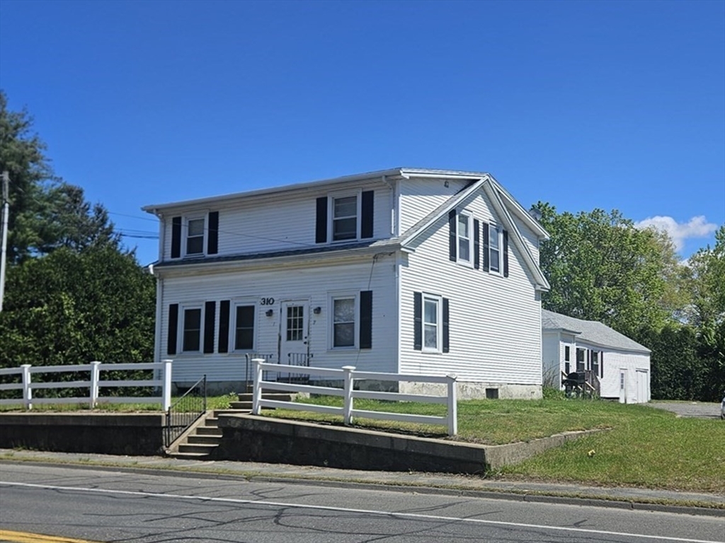 a view of houses with yard