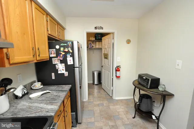 a view of kitchen island with furniture and wooden floor