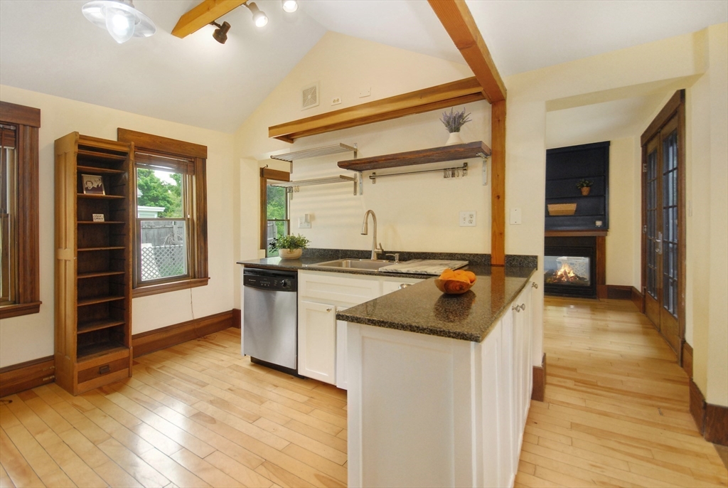 1832 Main Street Concord, MA 01742 - Photo 6 of 25 a kitchen with granite countertop a sink and cabinets