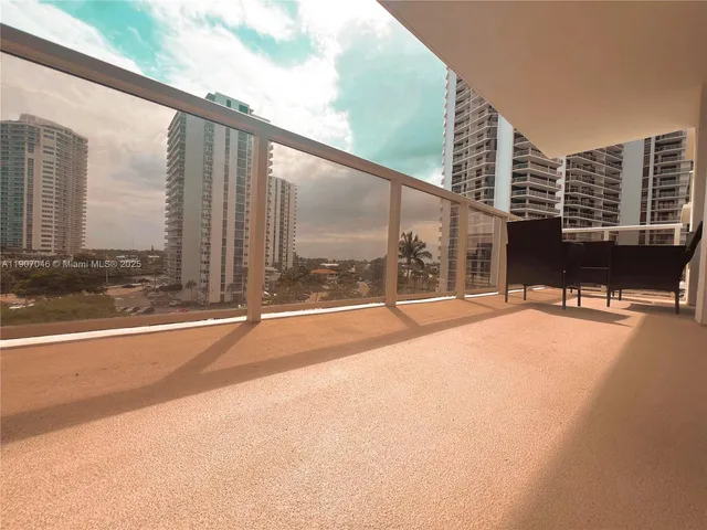 a view of swimming pool with lawn chairs and large windows