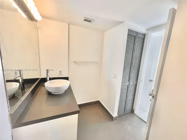 a view of bathroom with a tub and sink