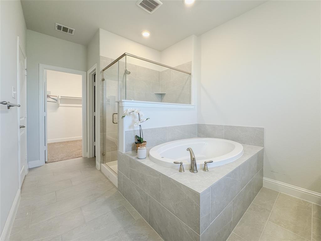 2000 Naples Drive Rowlett, TX 75088 - Photo 13 of 21 a white bath tub sitting in a bathroom