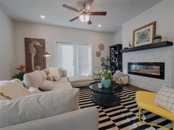 a living room with furniture and a fireplace