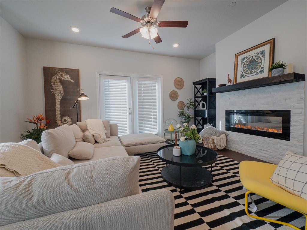2000 Naples Drive Rowlett, TX 75088 - Photo 3 of 21 a living room with furniture and a fireplace