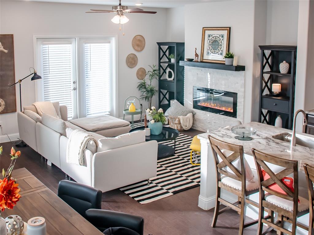 2000 Naples Drive Rowlett, TX 75088 - Photo 6 of 21 a living room with furniture a dining table and a fireplace