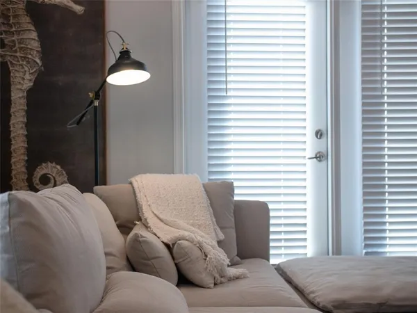 a bedroom with furniture and a window