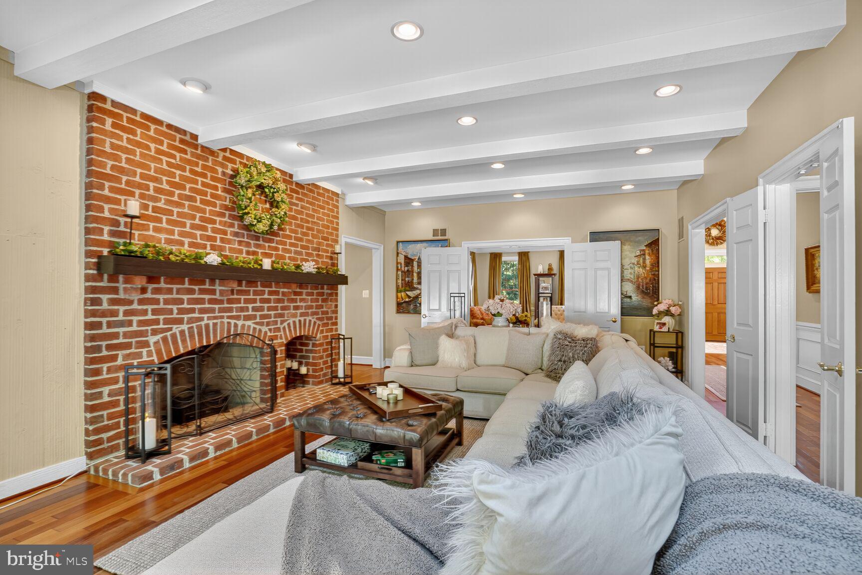 6705 Cedar View Court Clifton, VA 20124 - Photo 17 of 72 a living room with furniture a fireplace and a table