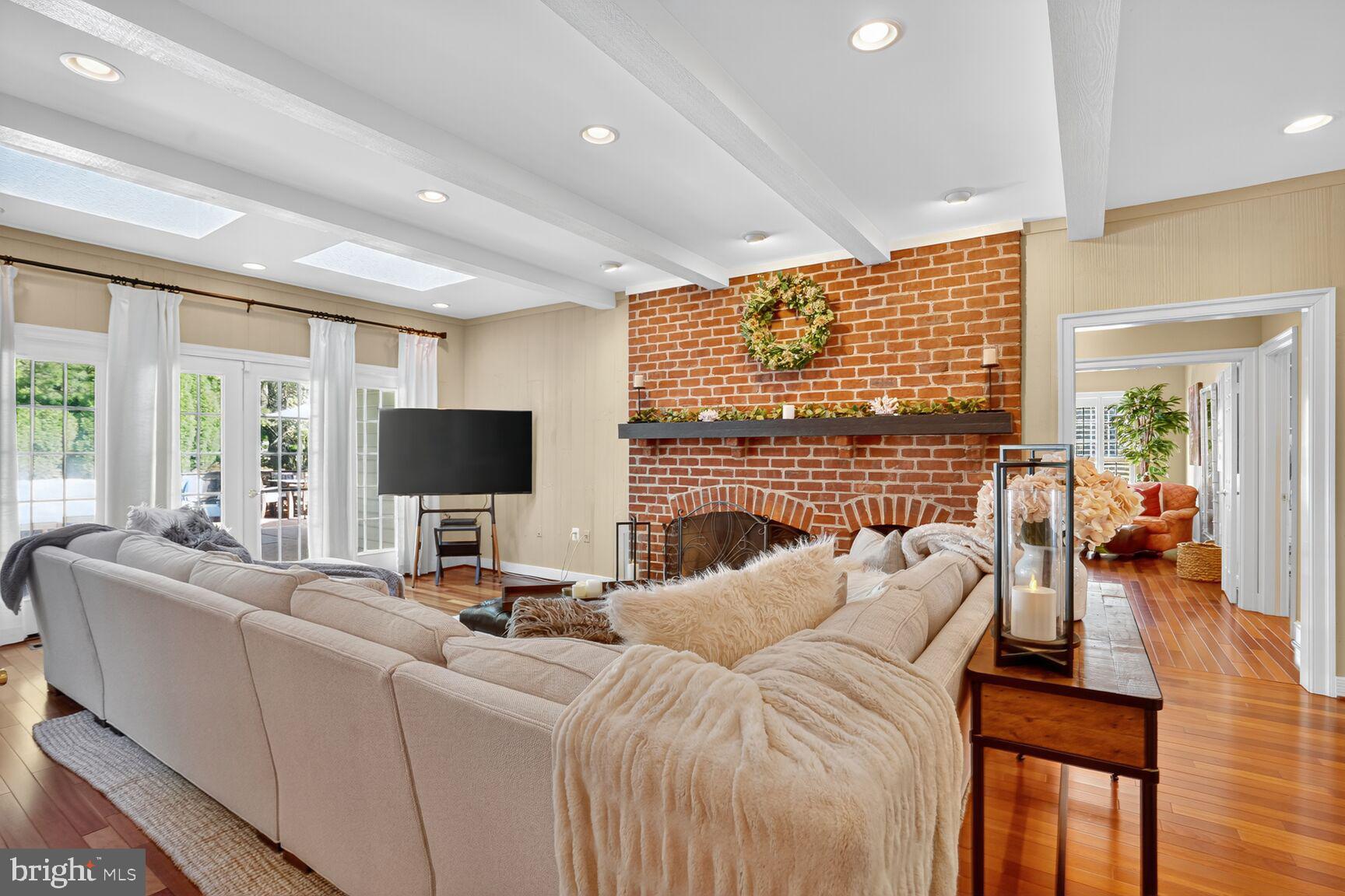 6705 Cedar View Court Clifton, VA 20124 - Photo 18 of 72 a living room with furniture a fireplace and a flat screen tv