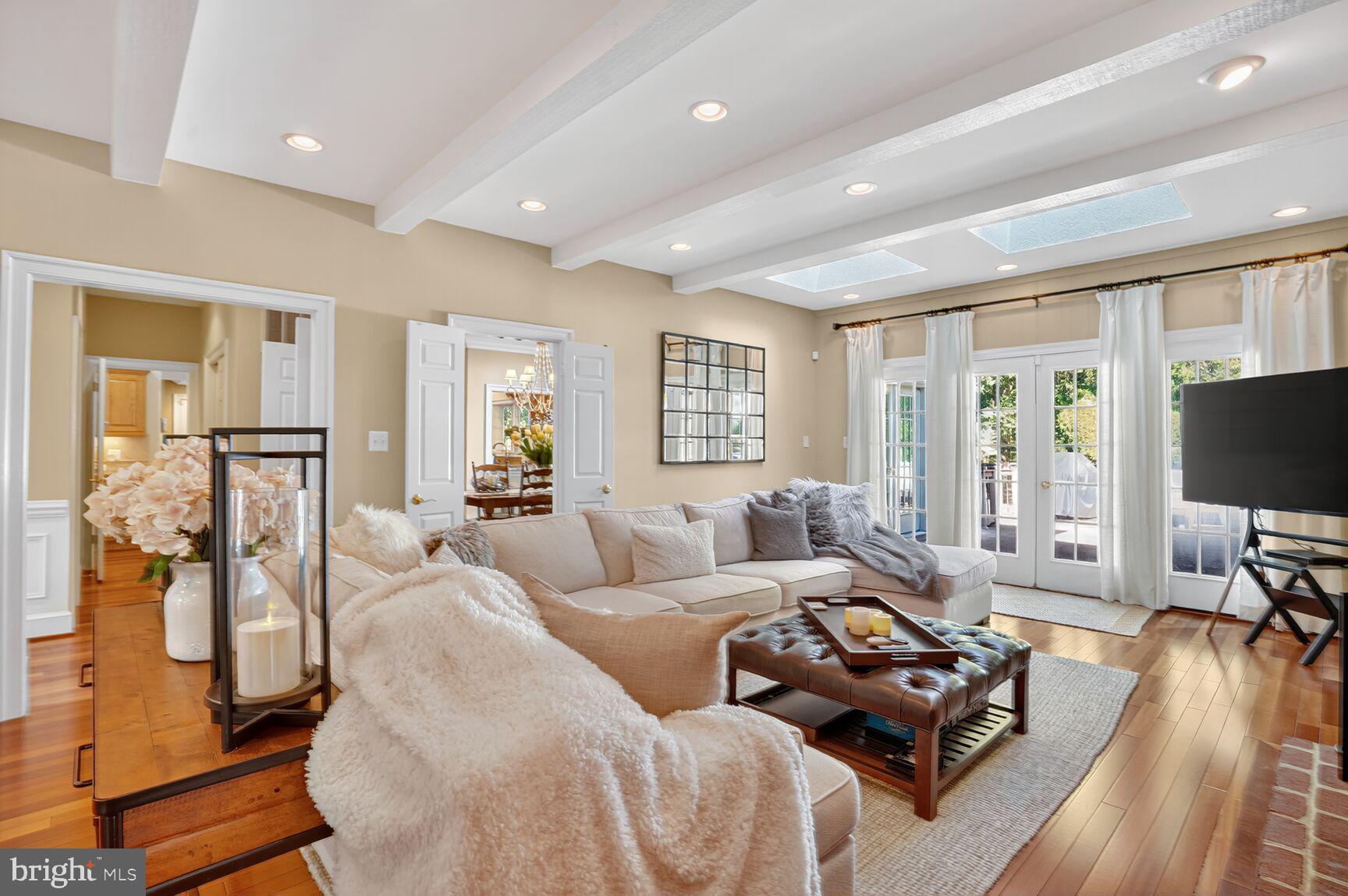 6705 Cedar View Court Clifton, VA 20124 - Photo 19 of 72 a living room with furniture a large window and a flat screen tv