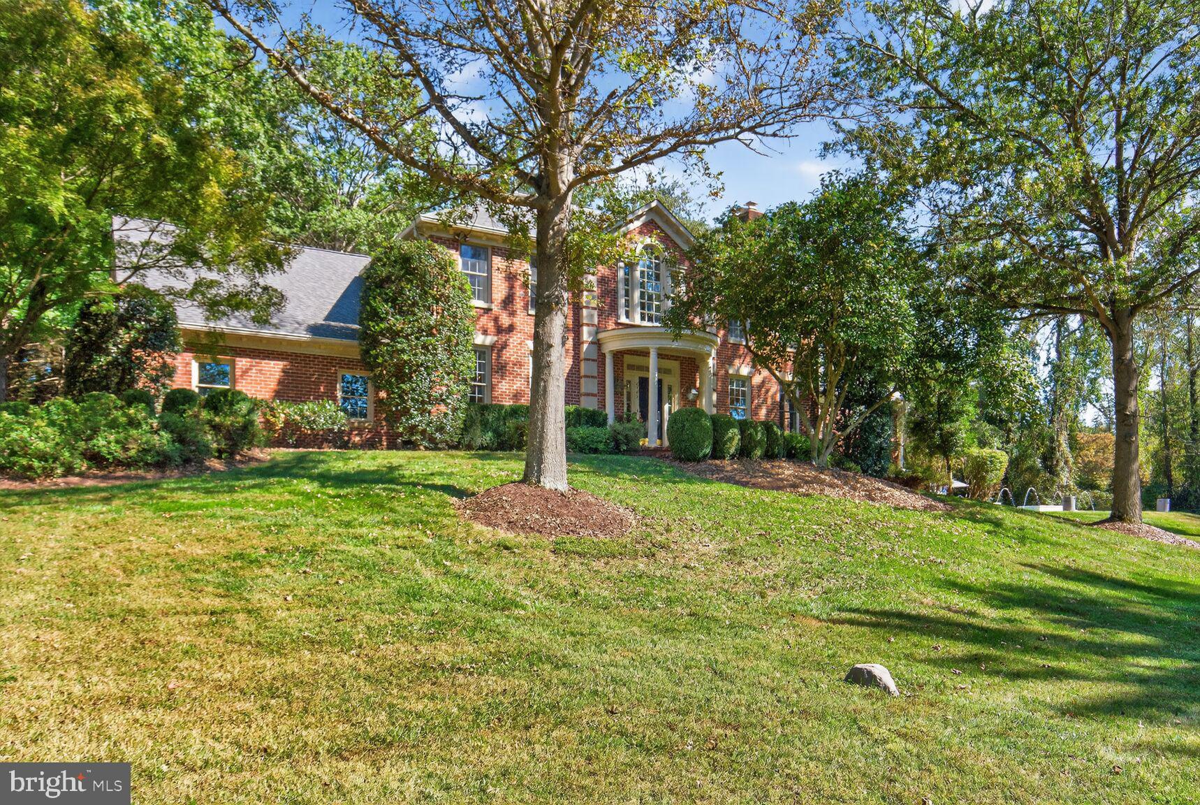 6705 Cedar View Court Clifton, VA 20124 - Photo 2 of 72 a front view of a house with a yard