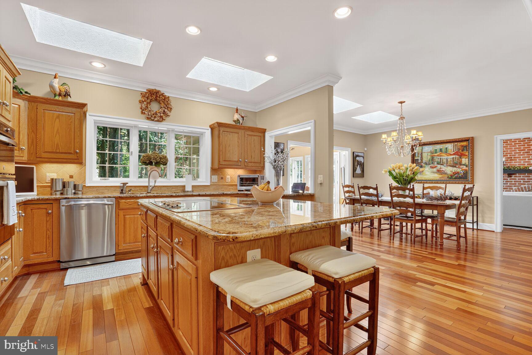 6705 Cedar View Court Clifton, VA 20124 - Photo 24 of 72 a large kitchen with lots of counter and chairs