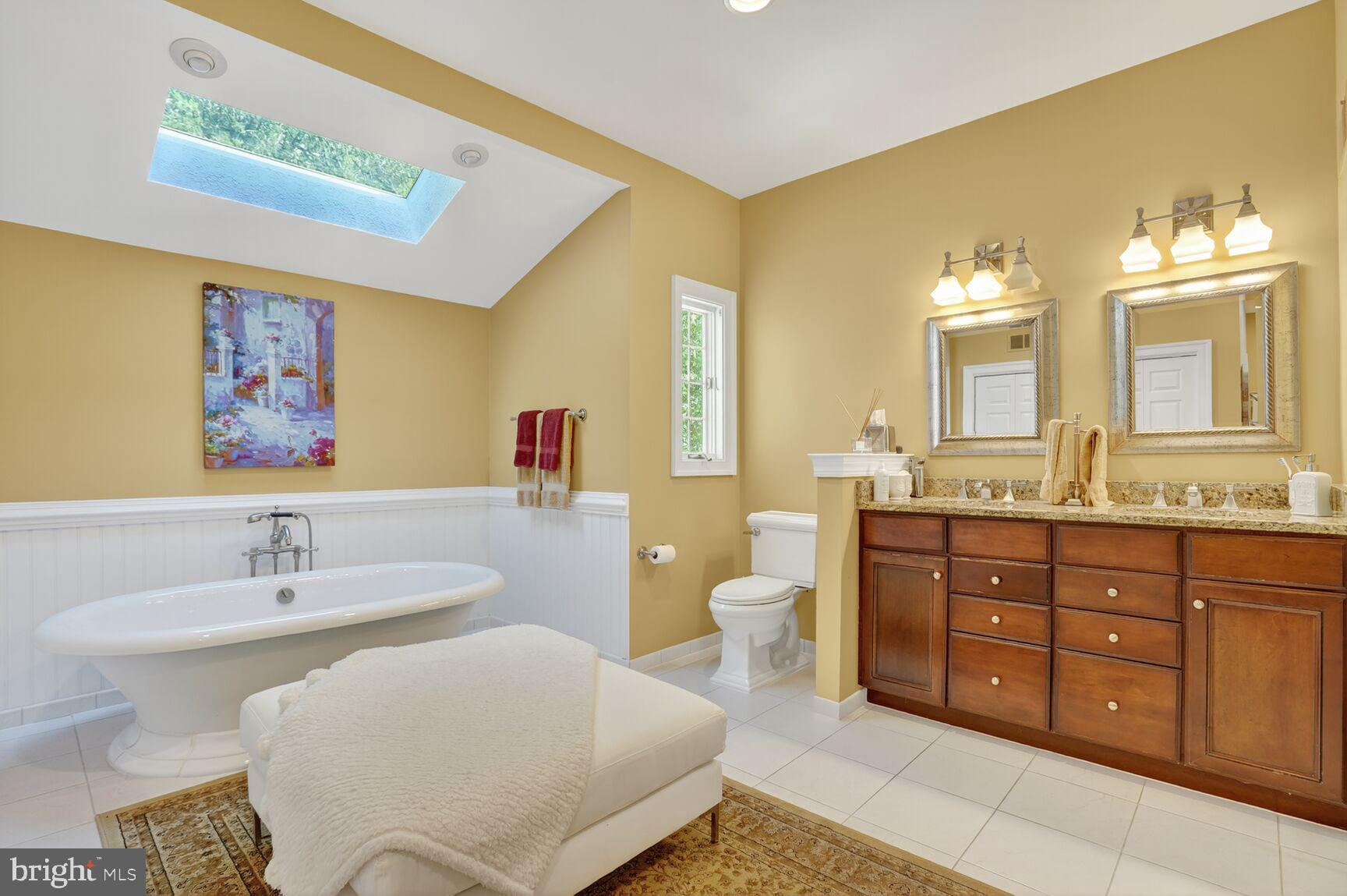 6705 Cedar View Court Clifton, VA 20124 - Photo 32 of 72 a spacious bathroom with a double vanity sink and a mirror
