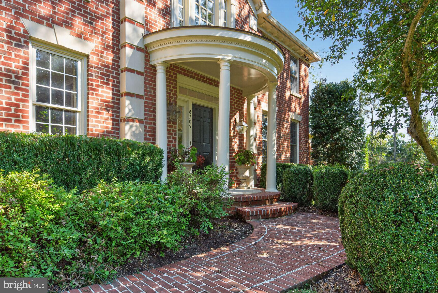 6705 Cedar View Court Clifton, VA 20124 - Photo 4 of 72 a view of a house with large windows and a lawn chairs