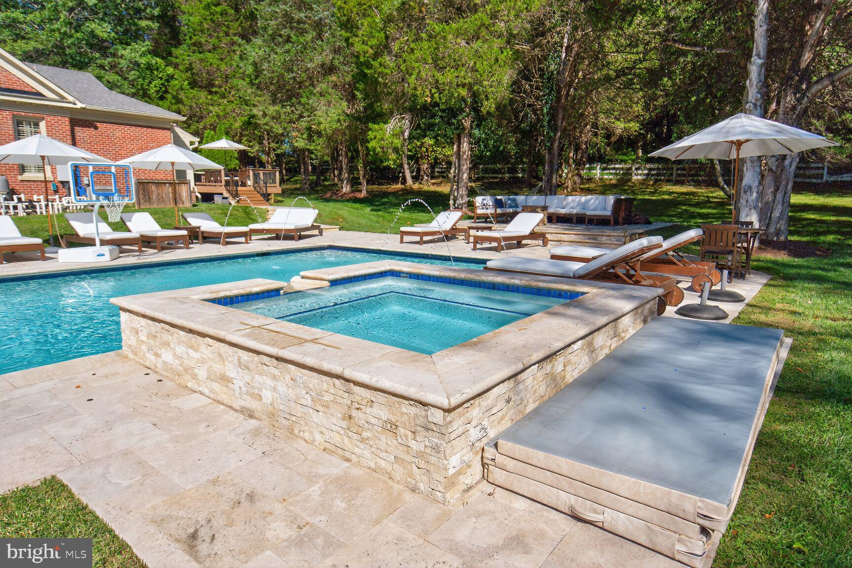 6705 Cedar View Court Clifton, VA 20124 - Photo 43 of 72 a view of a patio with a table and chairs under an umbrella