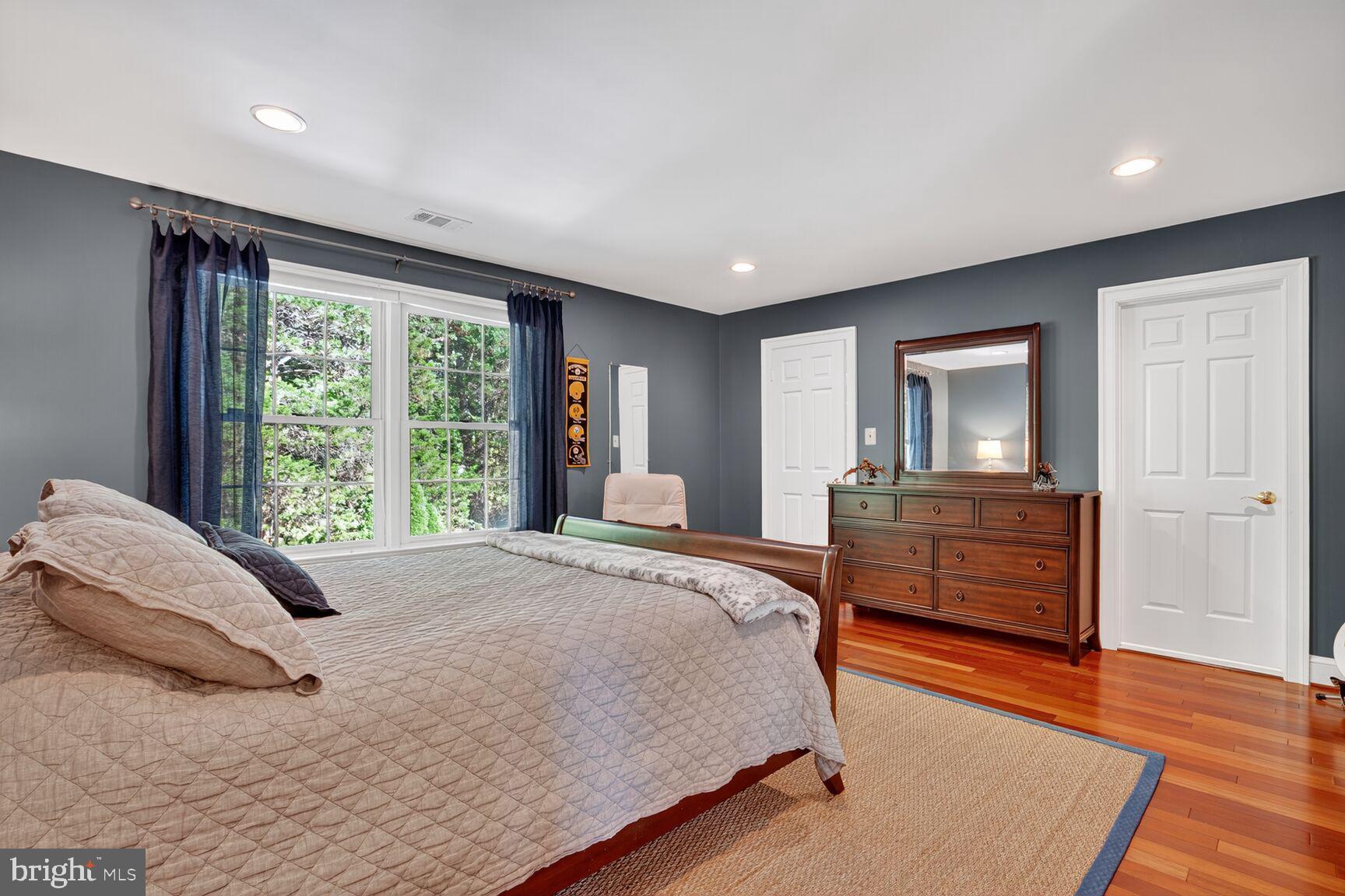 6705 Cedar View Court Clifton, VA 20124 - Photo 63 of 72 a bedroom with a bed and large windows