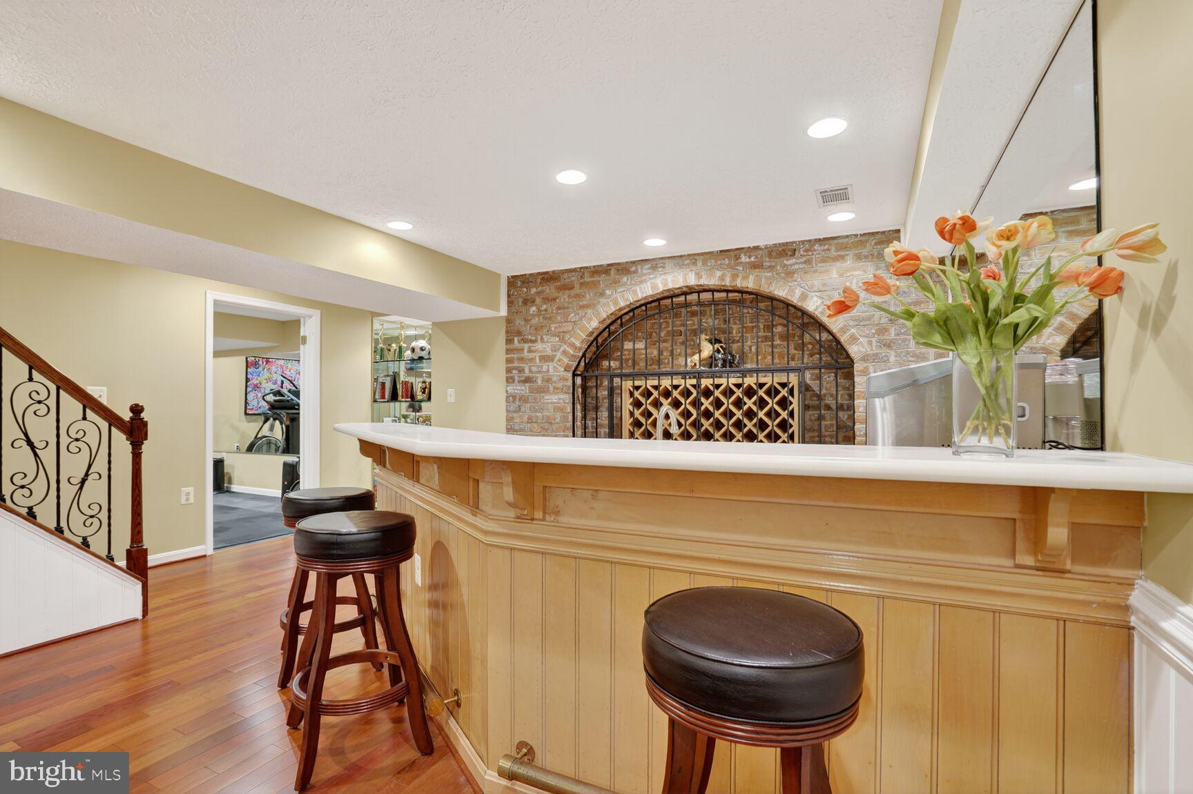 6705 Cedar View Court Clifton, VA 20124 - Photo 67 of 72 a view of entryway with kitchen island dining table and chairs