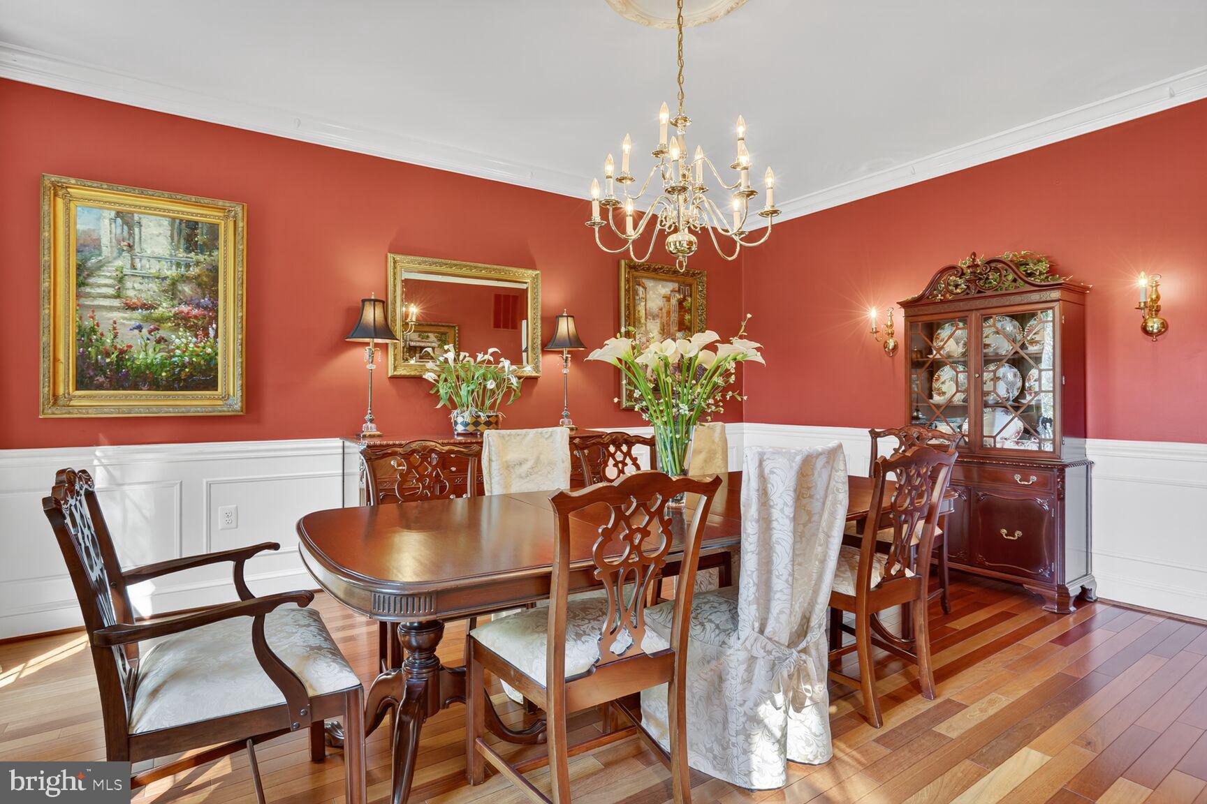 6705 Cedar View Court Clifton, VA 20124 - Photo 8 of 72 a view of a dining room with furniture a chandelier and wooden floor