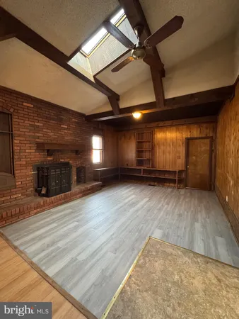 an empty room with wooden floor
