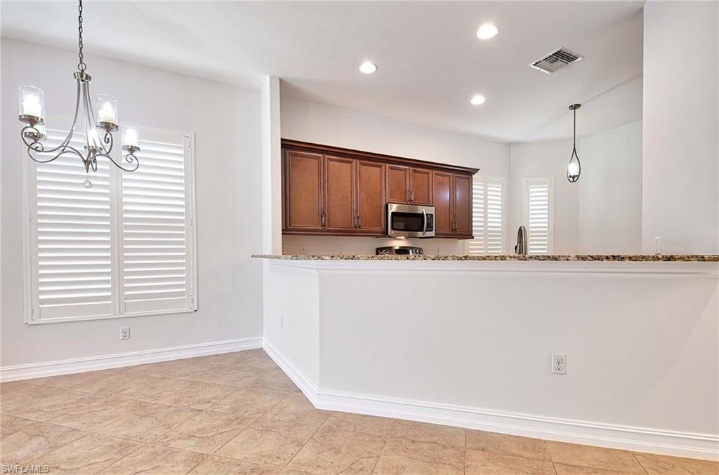 7409 Moorgate Point Way Naples, FL 34113 - Photo 4 of 42 LIVING AREA