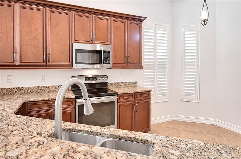 7409 Moorgate Point Way Naples, FL 34113 - Photo 8 of 42 KITCHEN
